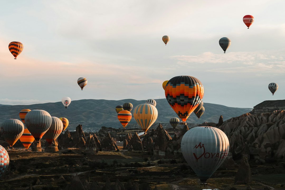 Balloons over the valleys of Cappadocia at dawn