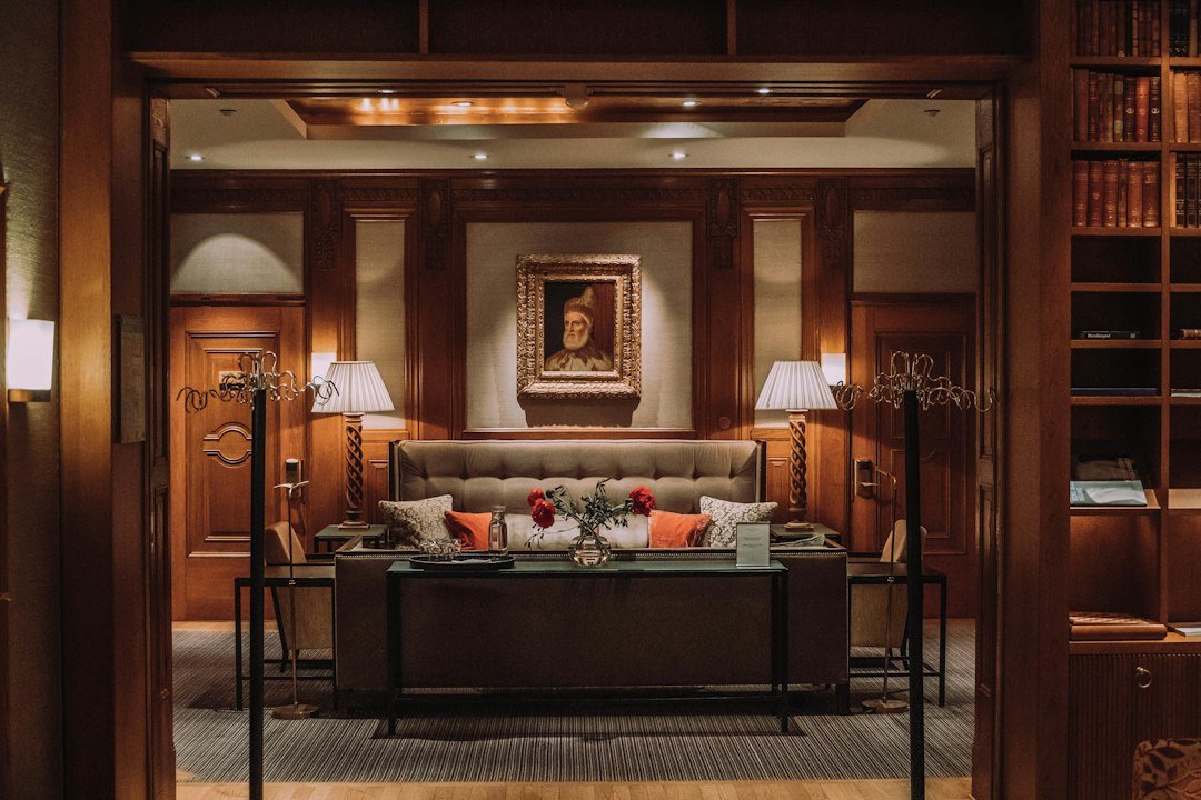 A warmly lit private lounge with classic wood panelling